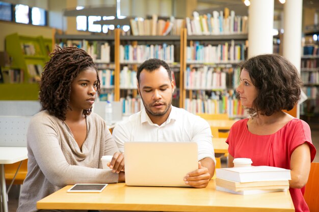 front view thoughtful people working library 74855 1930
